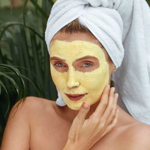 Woman With A Turmeric Face Mask